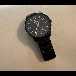 Coach watch gun metal black with copper accents approximately 42 to 43 mm face